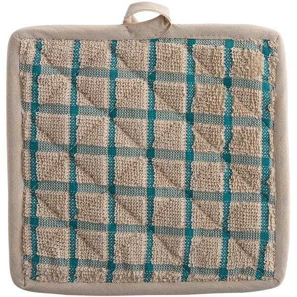A close up of a tan and green plaid Oxford Kitchen pot holder.