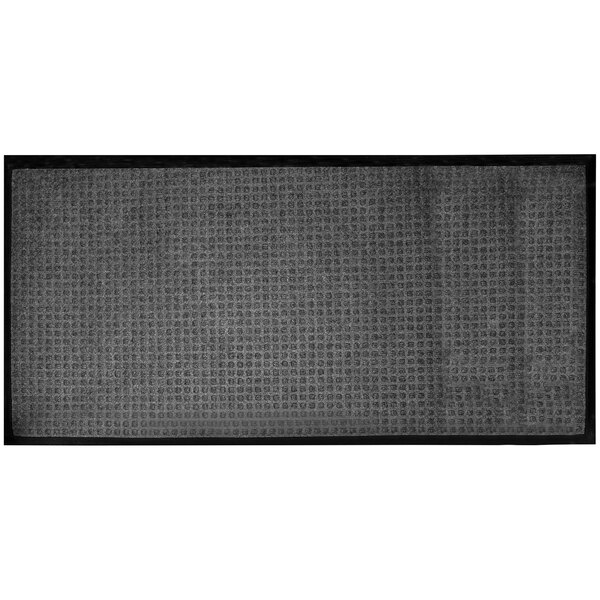 A grey rectangular rug with black lines along the border.