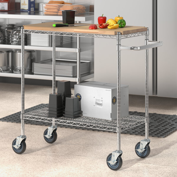 A Regency chrome utility cart with wooden shelves holding food.