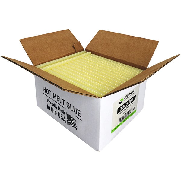 A white box of yellow Surebonder high temp glue sticks with yellow tubes inside.