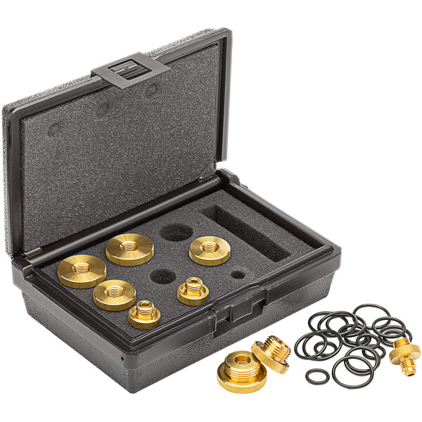 A black case with gold Zurn Quick Test brass fittings and tools.