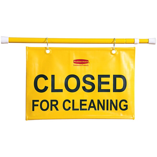 A yellow Rubbermaid "Closed for Cleaning" sign hanging.