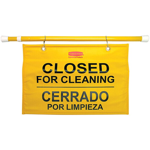 A yellow Rubbermaid "Closed for Cleaning" hanging sign with black text.