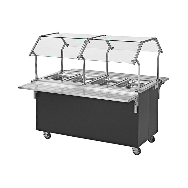 A Vollrath 4-Series stainless steel food warmer with glass trays on a counter.