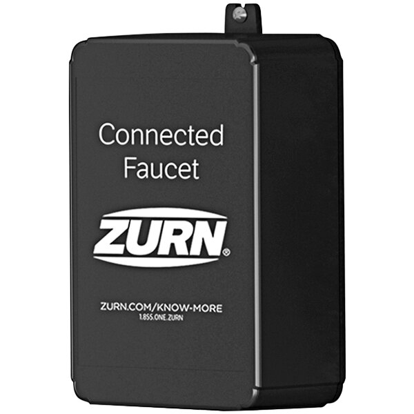A black rectangular Zurn sign with white text and a white logo.