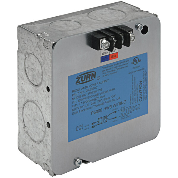 A metal box with a blue label that reads "Zurn Z-Series Hardwired Power Converter" for 6VDC.