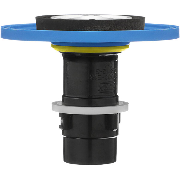 A black and blue plastic Zurn water valve with a round blue object.