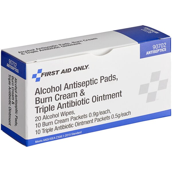 A white and blue First Aid Only box with black text containing first aid antiseptic pads, burn cream, and triple strength.
