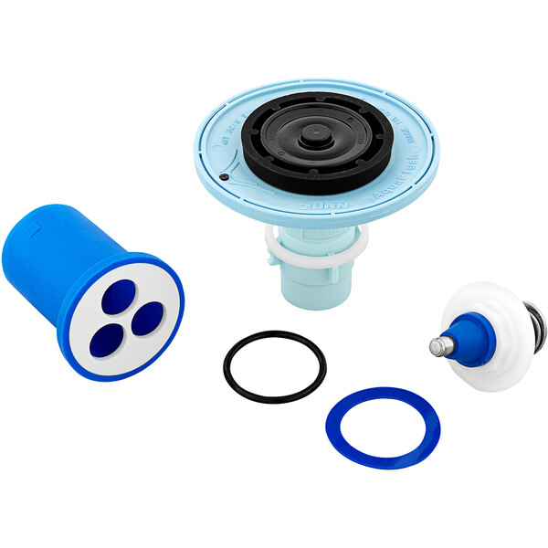 A blue and white plastic Zurn flush valve rebuild kit with rubber parts inside.