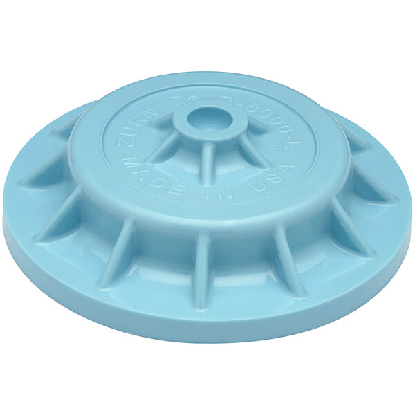 A blue plastic Zurn disc with text and a hole in the center.