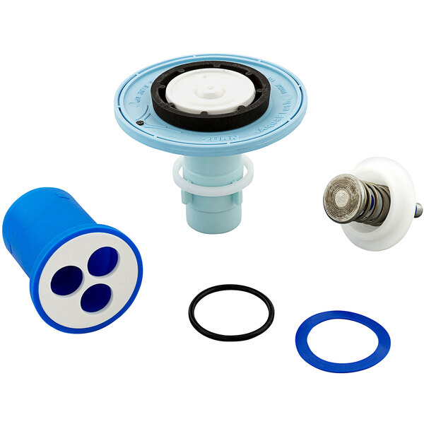 A blue and white plastic container with a Zurn Aquaflush water valve and rubber ring inside.