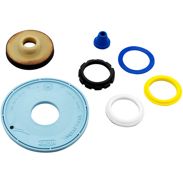 A variety of rubber and plastic round objects with a hole in them for Zurn AquaFlush flushometers.