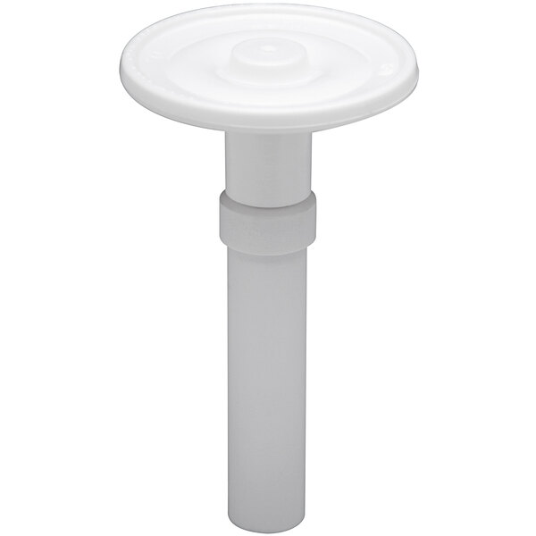 A white plastic Zurn trip mechanism with a round disc inside.