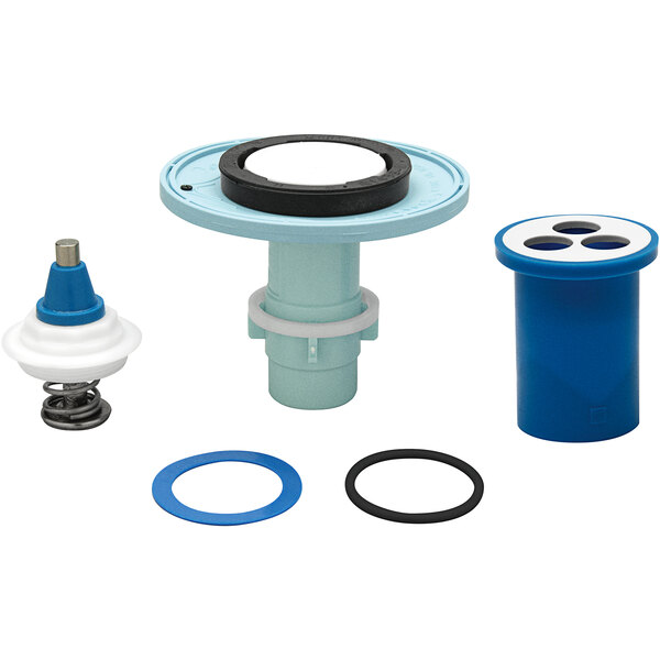 A Zurn AquaFlush closet rebuild kit with blue and white parts including a blue cylinder with holes and rubber seals.