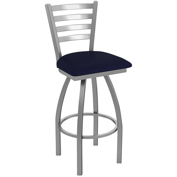 A Holland Bar Stool outdoor restaurant bar stool with a blue cushion and stainless steel frame.