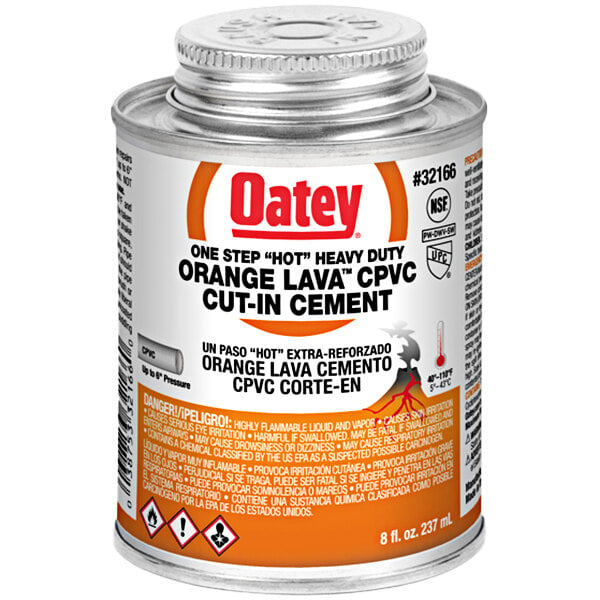 An orange and white can of Oatey CPVC orange lava cement with a black and orange logo.