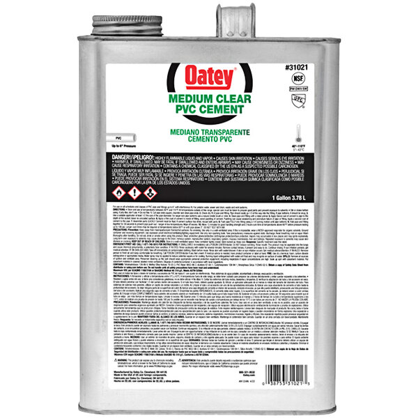A silver can of Oatey PVC medium clear cement with black and red text.