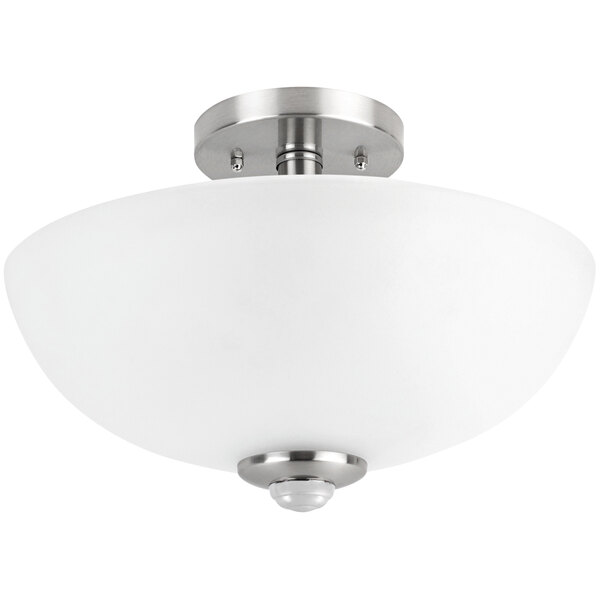 A Globe semi-flush mount ceiling light with a glass shade and metal accents.