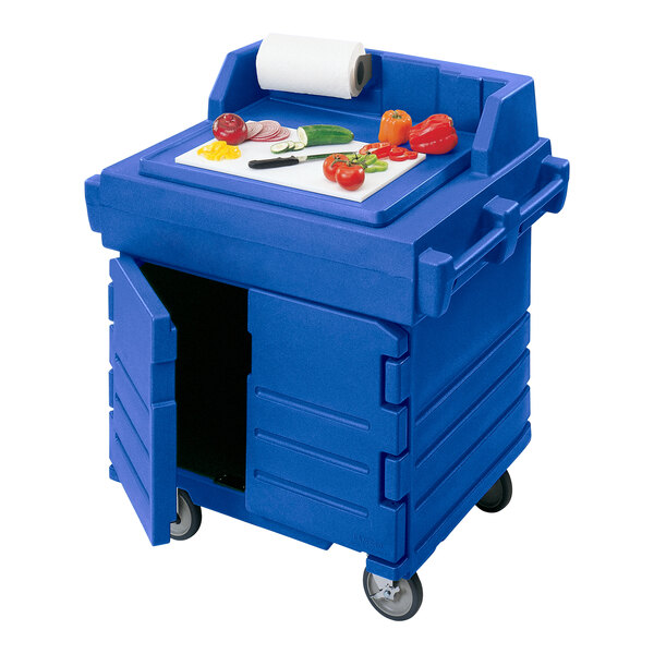 A blue plastic Cambro food cart with vegetables on it.