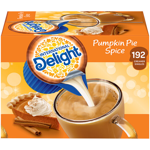 A box of International Delight Pumpkin Pie Single Serve Non-Dairy Creamer on a counter.