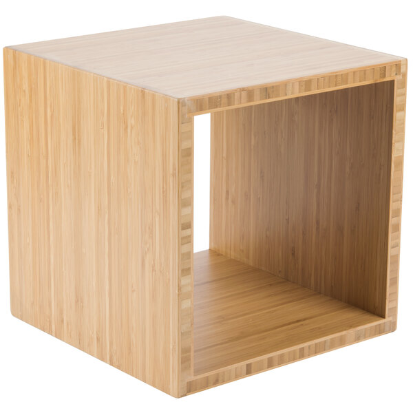A square wooden cube display riser.