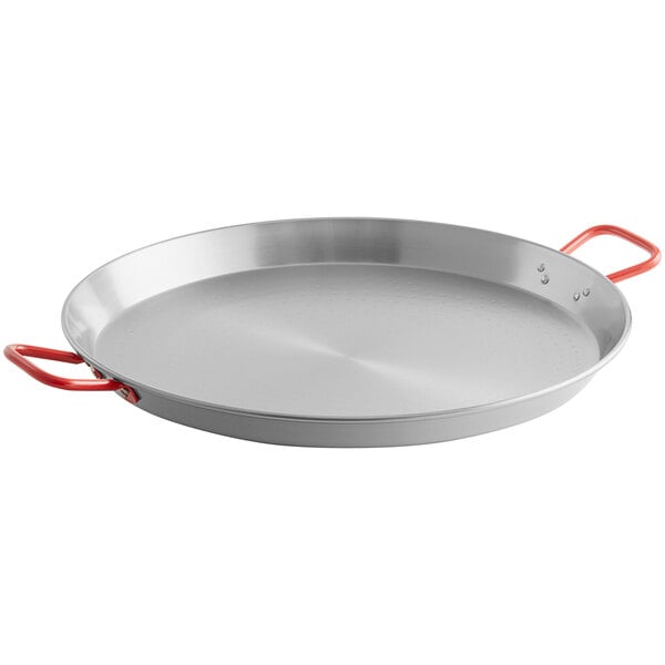 A silver 24" carbon steel paella pan with red handles.