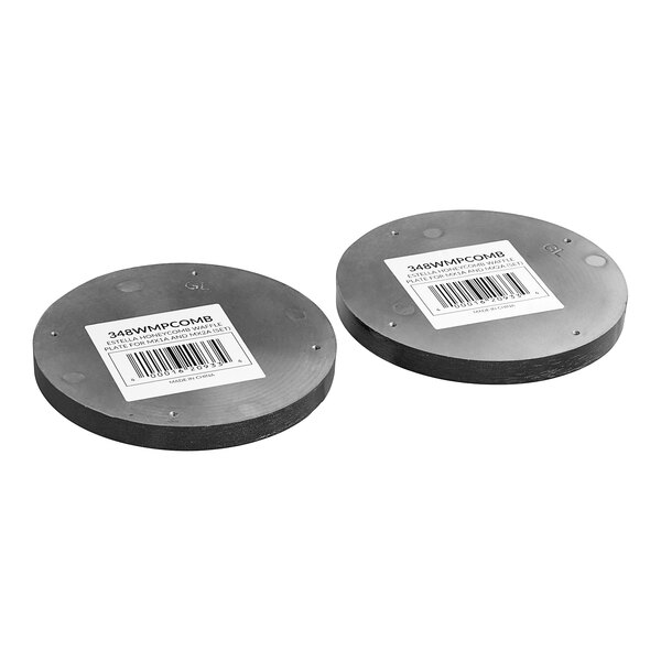 A pair of round metal honeycomb waffle plates with barcodes.