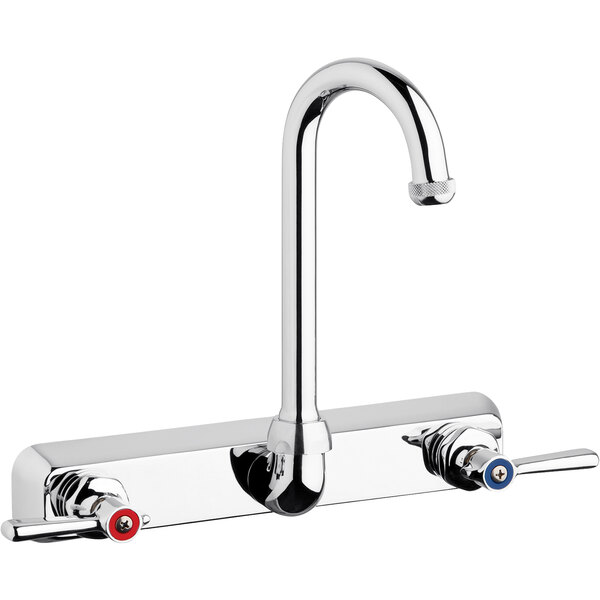 A silver and chrome Chicago Faucets wall-mounted faucet with two red and silver handles and a gooseneck spout.