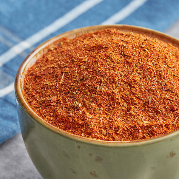 A bowl of Regal Taco Seasoning on a table.