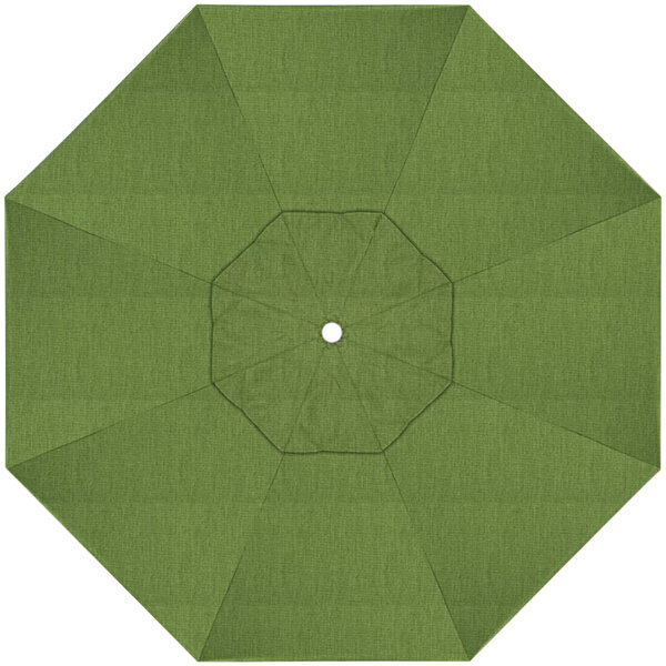 A green umbrella with a white center and a hole in the middle.