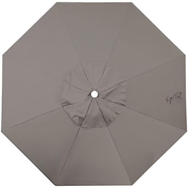 A taupe California Umbrella canopy with a hole in the middle.