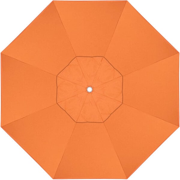 An orange umbrella with a white center.