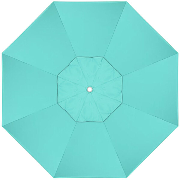 A top view of a blue California Umbrella sunbrella with a white center.