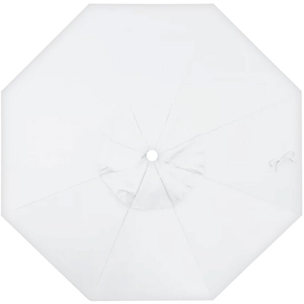 A white umbrella with a circle in the middle.