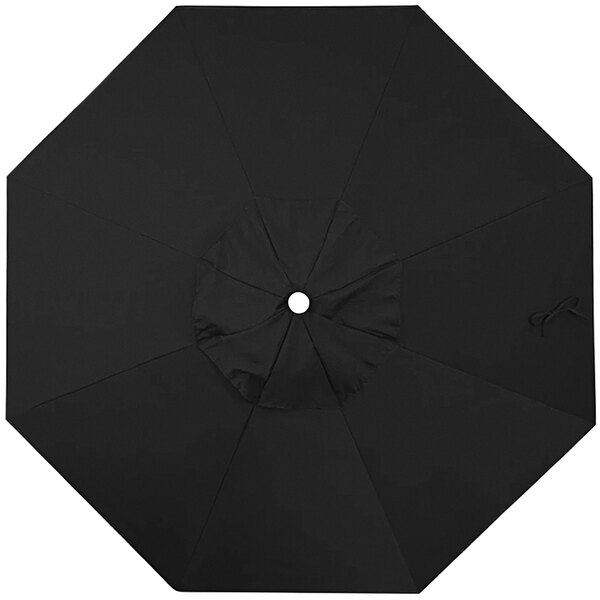 A black umbrella with a white circle in the center.