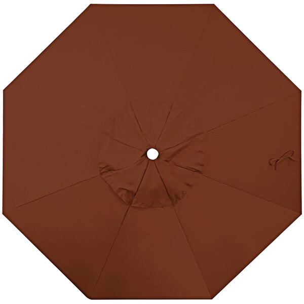 A close-up of a brown California Umbrella replacement canopy with a hole in the middle.