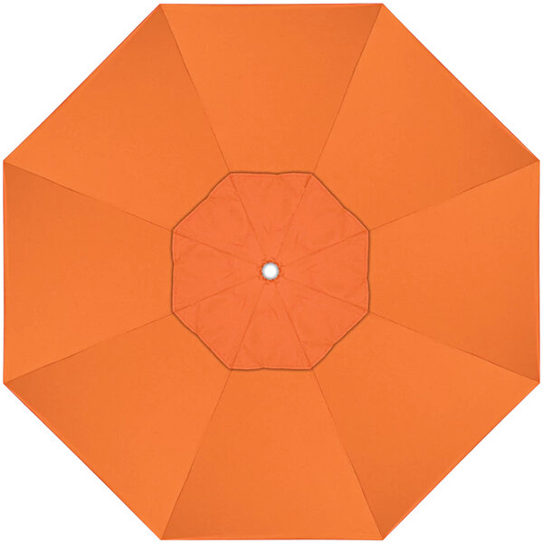 An orange umbrella with a white circle in the center.