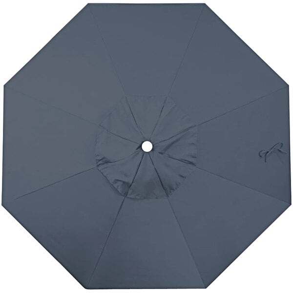 A close-up of a sapphire blue California Umbrella canopy with a hole in the middle.