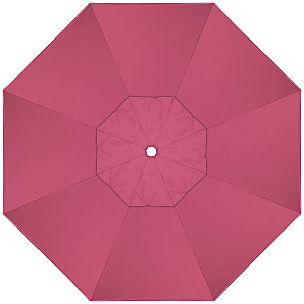 A hot pink sunbrella replacement canopy with a white circle in the center.