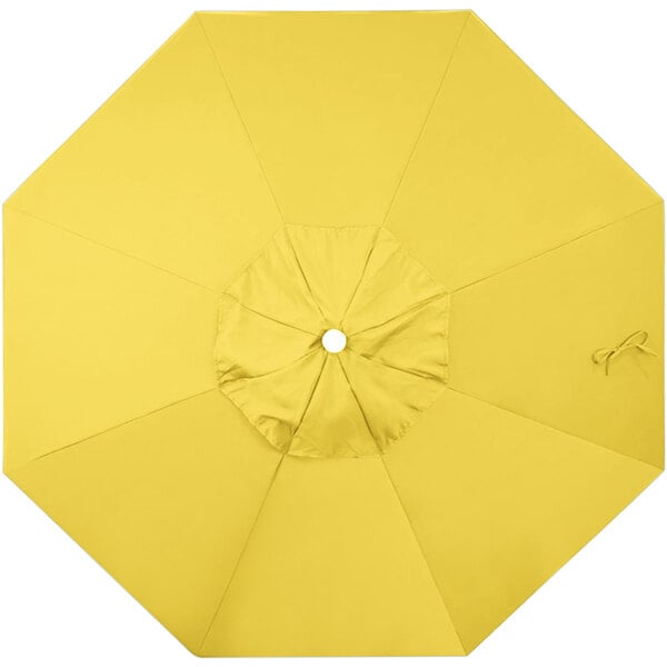 A yellow umbrella with a white circle.
