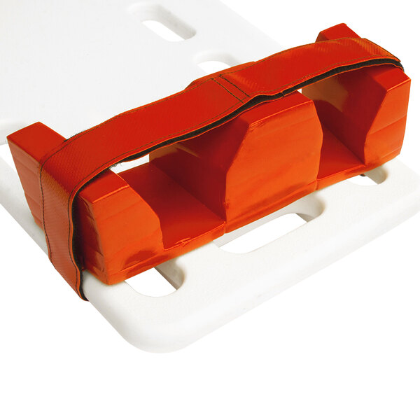 A white and orange plastic bag with a red object inside and a strap.