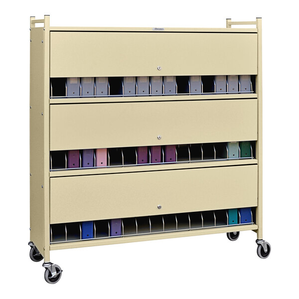 A beige metal Omnicart with several drawers.