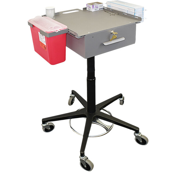 An Omnimed phlebotomy cart with a grey rectangular tray and red container on a black cart.