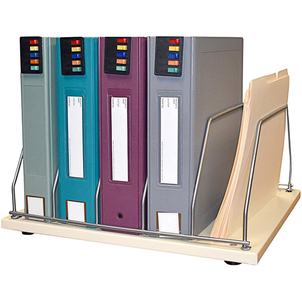 A beige Omnimed countertop storage rack with 5 sections holding binders.