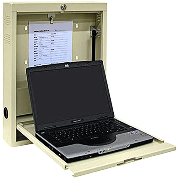 A beige Omnimed wall desk with a laptop inside a metal box.