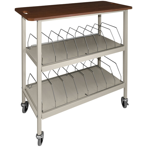 An Omnimed beige metal chart cart with cherry wood top and wheels.