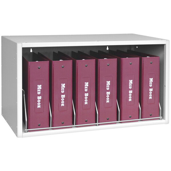A light gray Omnimed Cubbie file rack with red binders on it.