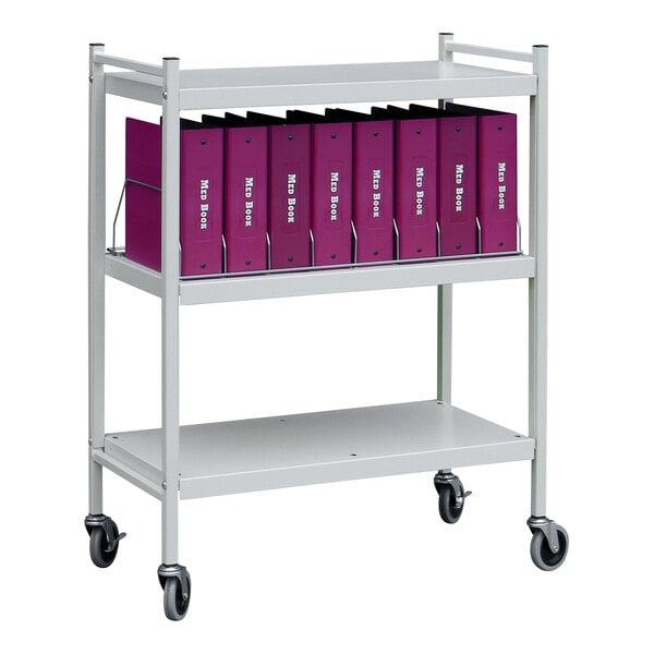 An Omnimed light gray metal cart with purple binders on it.
