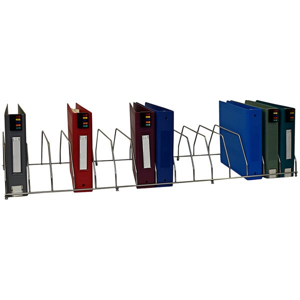 A metal rack with several Omnimed binders in it.