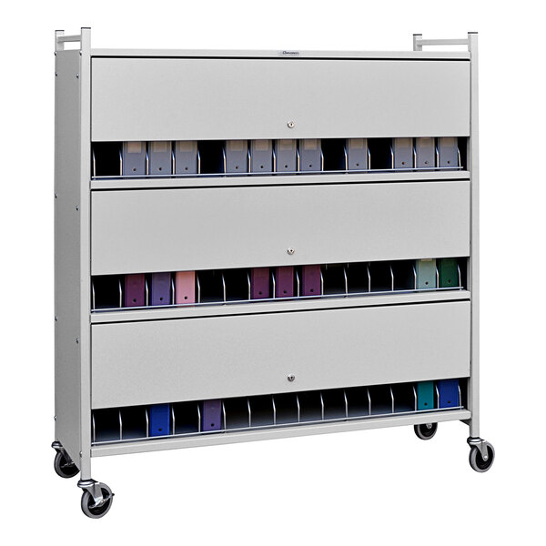 A light gray Omnimed metal cart with closed drawers and a locking panel with many different colored folders inside.